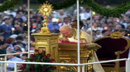 St. John Paul II prays before the Blessed Sacrament