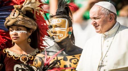 Pope Francis (right) poses with native Mexican people during his General Weekly Audience in St. Peter's Square on August 29, 2018. 