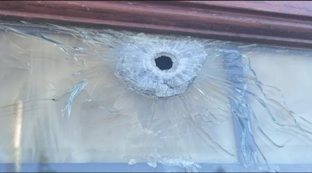 A gunman shot bullet holes into a Denver-area Catholic church on Saturday and again Monday