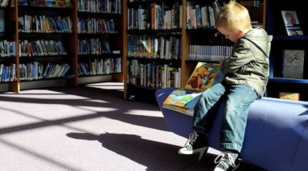 kid with books